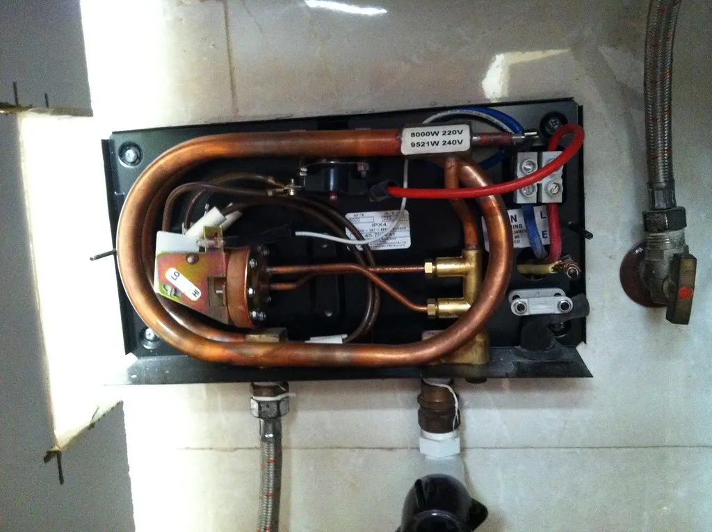 Internal heating elements and copper piping of a tankless water heater